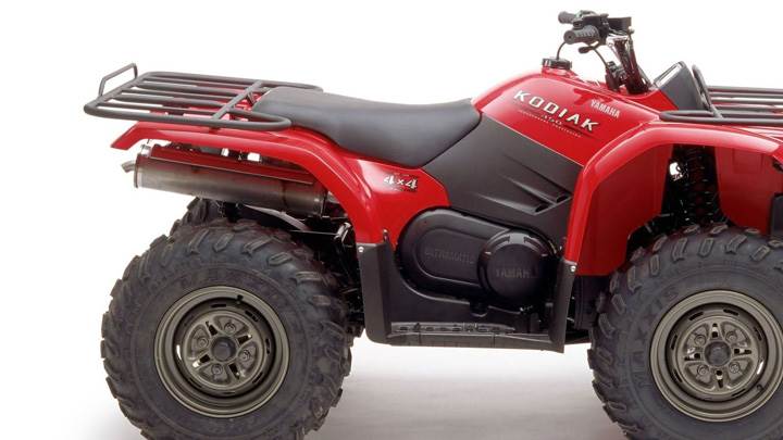 Yamaha Kodiak 450 In Red Side Pose And White Background